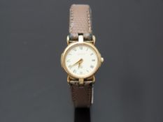 Gucci gold plated ladies wristwatch ref. 3400 with gold dauphine hands, black Roman numerals,