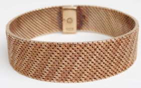 A 9ct gold bracelet with textured links, 53.2g