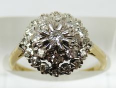 An 18ct gold ring set with diamonds in a platinum cluster, 3.8g, size M