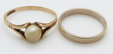 A 9ct gold ring and a 9ct gold wedding band, 3g