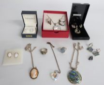 A collection of silver jewellery including a suite of abalone jewellery, mother of pearl suite of