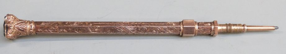 Yellow metal propelling pencil with hardstone finial, marked E.B 9ct, length when extended 13.5cm,