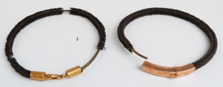 Two braided Victorian bracelets one with a yellow metal clasp and the other a gilt clasp