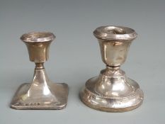 Two hallmarked silver squat candlesticks, one Birmingham 1925, the other 1931, height of taller 8.