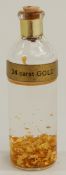 A bottle of 24ct gold leaf.