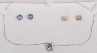 A 9ct white gold necklace and earrings set with topaz