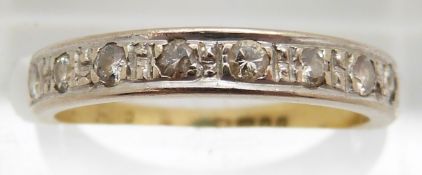 An 18ct gold half eternity ring set with diamonds in a white gold setting, 2.8g, size M