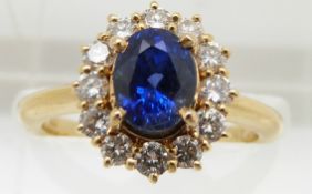 An 18ct gold bespoke ring set with a 1.7ct natural untreated royal blue sapphire surrounded by