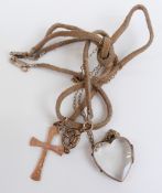 Victorian heart shaped locket, 2.5cm long, and a 9ct gold cross, Birmingham 1943, 3.5cm long