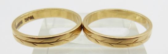 A pair of 18ct gold rings with foliate decoration, 4.7g, both size M