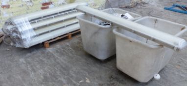 A collection of industrial strip lights together with various electrical heaters and parts and two