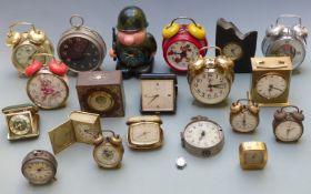 A large collection of alarm clocks etc to include novelty examples, travel alarms, Estyma, Westclox,