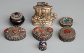 Six white metal or similar Eastern lidded pots and an Oriental style lighter formed as a boat