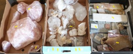 A collection of mineral samples including clear and rose quartz and cut examples.