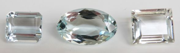 A rectangular cut aquamarine measuring approximately 7.4ct, an oval cut aquamarine measuring