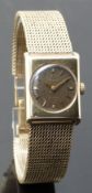 Omega 9ct gold ladies wristwatch with gold hands and baton markers, tropical brown dial and signed
