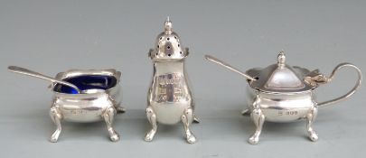 Elizabeth II hallmarked silver three piece cruet set with blue glass liners, Sheffield 1973 maker