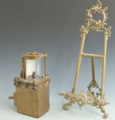 Bronze ship's mast head or similar lamp, height 31cm and an ornate brass easel