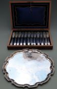 Silver plated salver, diameter 35cm, and a boxed set of 12 fish knives and forks