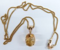 A 9ct gold necklace with pendant set with an oval cut citrine and diamond, 24cm drop, 5.8g