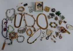 A collection of costume jewellery including Monet, Butler & Wilson, Trifari, 9ct gold ring (2.4g)
