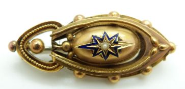 Victorian Etruscan Revival yellow metal brooch set with a pearl to the centre surrounded by a blue