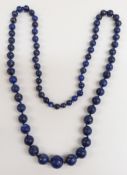 A lapis lazuli necklace of 72 graduated carved spherical beads, the largest 16mm in diameter.