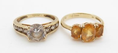 A 9ct gold ring set with topaz and a 9ct gold ring set with cubic zirconia, 5.7g