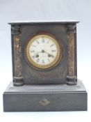 Oak aneroid barometer and a black slate mantel clock with Smith, Cranbrook, Kent to Roman dial,