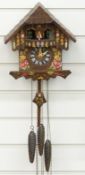 German three train cuckoo clock with musical automaton dancers feature on the hour and half hour,