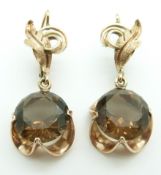 A pair of rose gold earrings set with smoky quartz, 10.3g