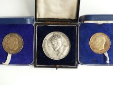 Three cased 20thC silver medal coins, one for George V and Queen Mary, and two for Edward Duke of