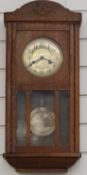 Oak wall clock with two train movement, 59cm tall