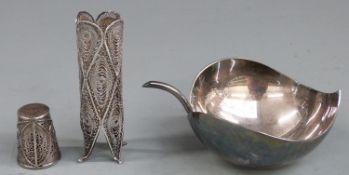 A white metal filigree posy or similar holder marked 925, filigree thimble and a silver plated