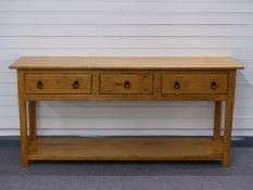 Light oak or elm dresser with three drawers above shelf, W173 x D46 x H82cm