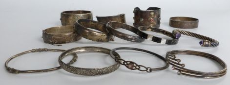 Four hallmarked silver bangles, six various bangles marked 925 including an Arts and Crafts style