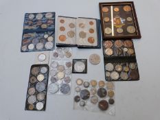 A small amateur collection of UK and overseas coins and commemoratives, includes very small silver