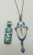 A silver pendant set with floral enamel by J A & S, and a silver pendant set with opal sections
