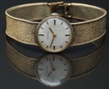 Marvin 9ct gold ladies wristwatch with gold hands, two-tone hour markers, silver dial and signed