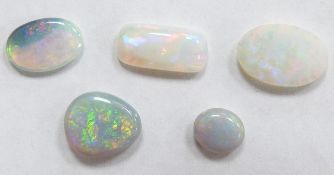 Four oval opal cabochons and a rectangular opal cabochon, largest 11.5 x 5.6 x 3mm and smallest 6.