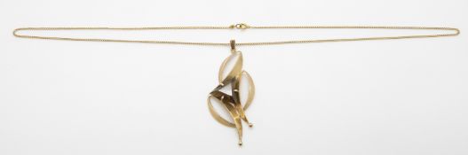 A 9ct gold pendant set with a triangular smoky quartz on 9ct gold chain, 8.7g, 33.5cm drop