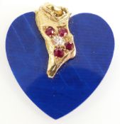 An 18ct gold pendant set with faux lapis lazuli, an oval cut diamond of approximately 0.2ct and four