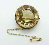 Victorian gold brooch set with a large round cut citrine within a rope twist border, 18.5g, diameter