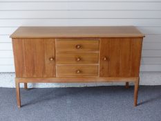 Gordon Russell of Broadway sideboard with three drawers flanked by two cupboards, W142 x D39 X