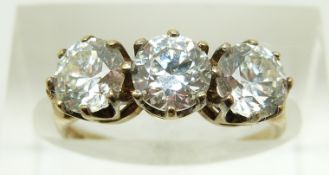 A 9ct gold ring set with three cubic zirconia, 2.3g, size L
