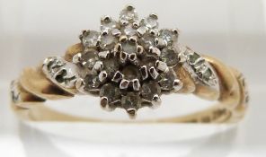 A 9ct gold ring set with diamonds in a cluster, 2.4g, size O