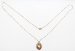 A 9ct gold locket on a 9ct gold chain, 1.9g, 24cm drop