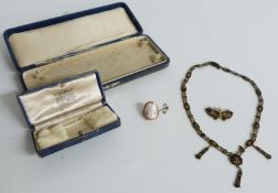 A yellow metal brooch set with a cameo and a Japanese necklace