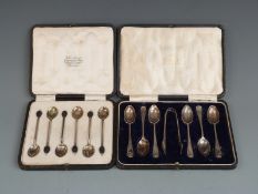 Two cased sets of hallmarked silver tea or coffee spoons, one set with sugar tongs London 1918 in