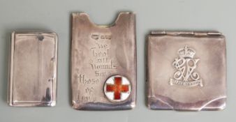 Three early 20th century hallmarked silver cases comrpising card slip case with enamel red cross and